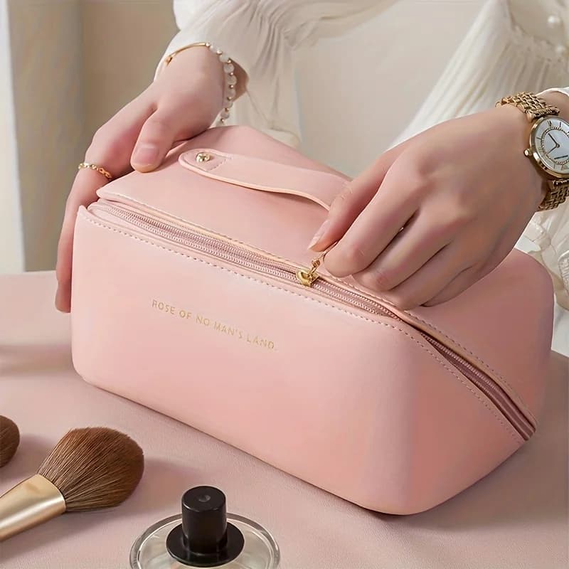 Makeup organiser with compartments holding brushes and cosmetics