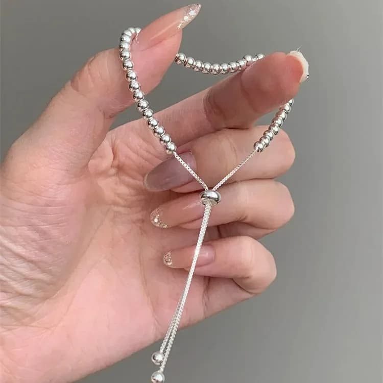 Close-up detail of the 925 sterling silver bead bracelet showing the individual bead texture and adjustable clasp