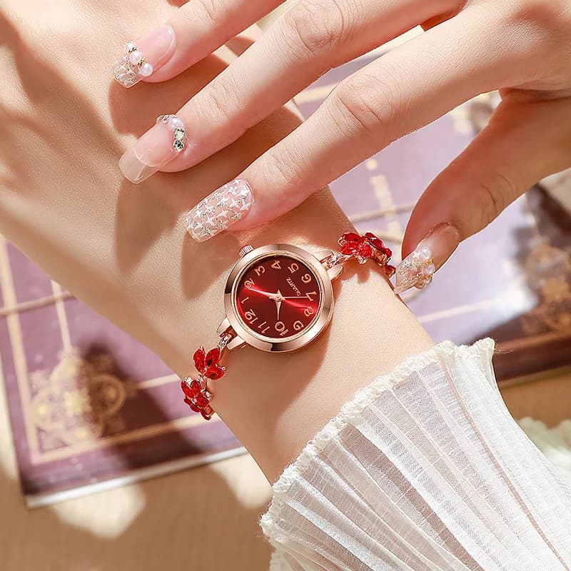 The rhinestone bracelet watch worn on a wrist, showing how it sits and catches the light