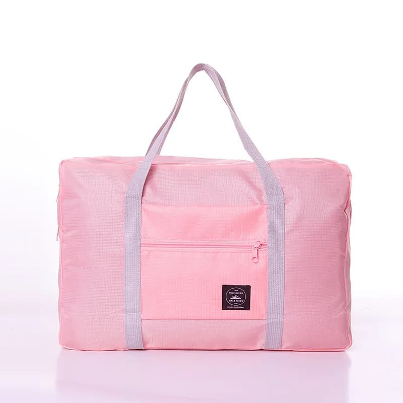 The foldable duffel in Red with packed contents visible