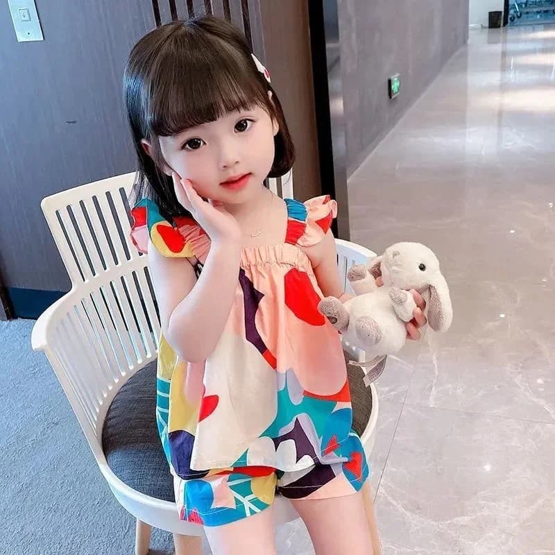 Baby girl outfit styled for a garden party with the floral suspender set