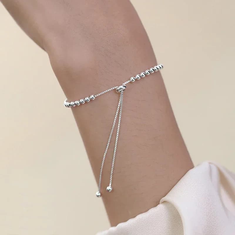 Side angle of the sterling silver bead bracelet showing the bead spacing and overall length