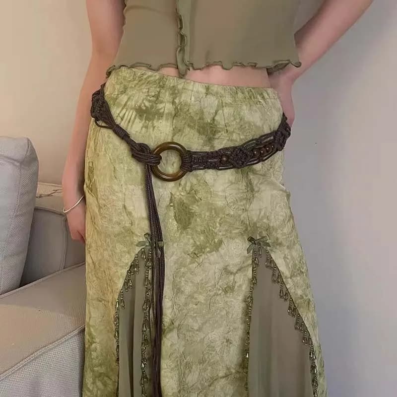 Close-up of the woven brown bead pattern on the waist chain, showing the intricate hand-crafted detail