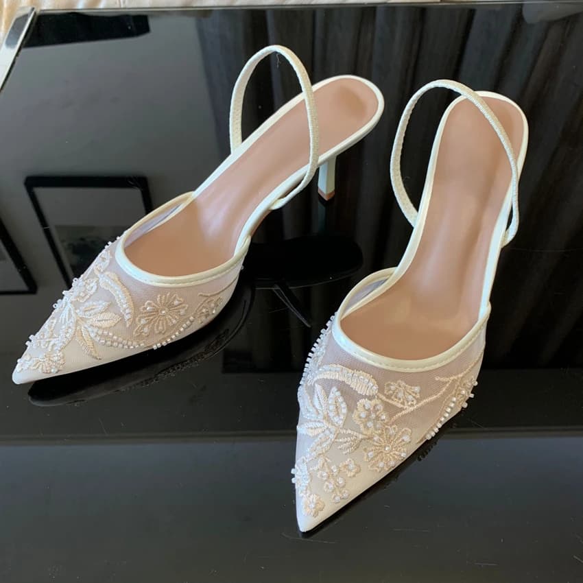 White heels worn at a summer wedding