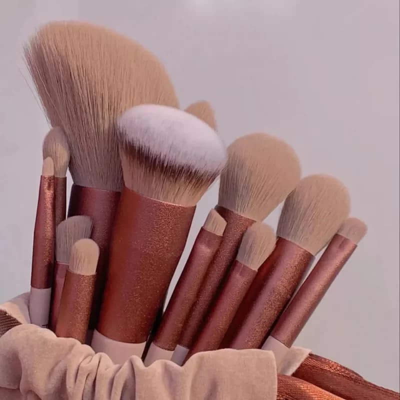 Fan brush picking up translucent setting powder from a container